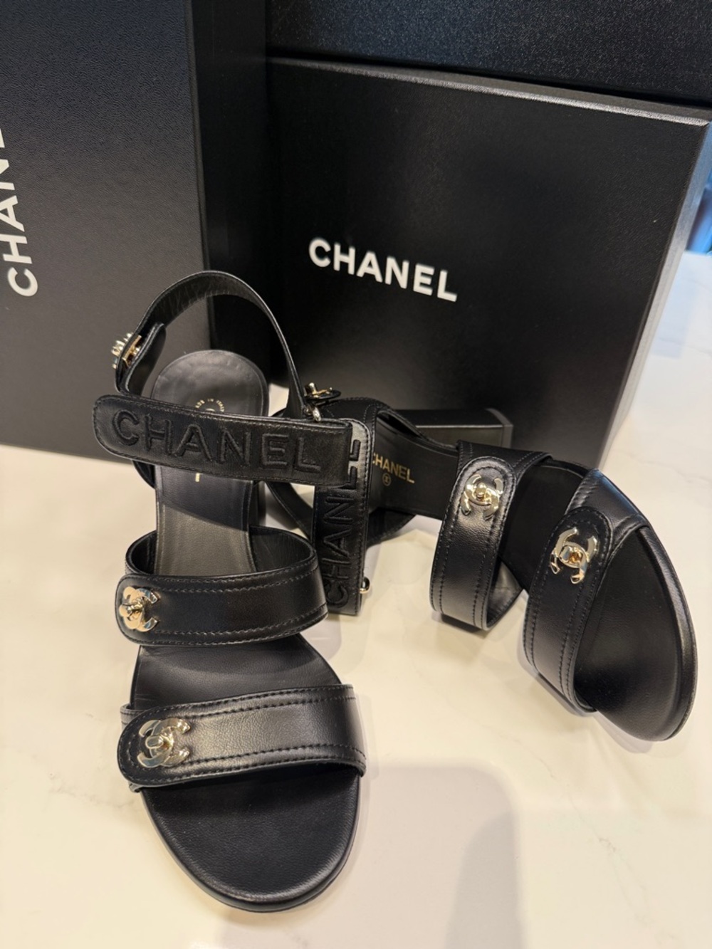 CHANEL Black Leather Logo Strap Sandals with Gold CC Accents